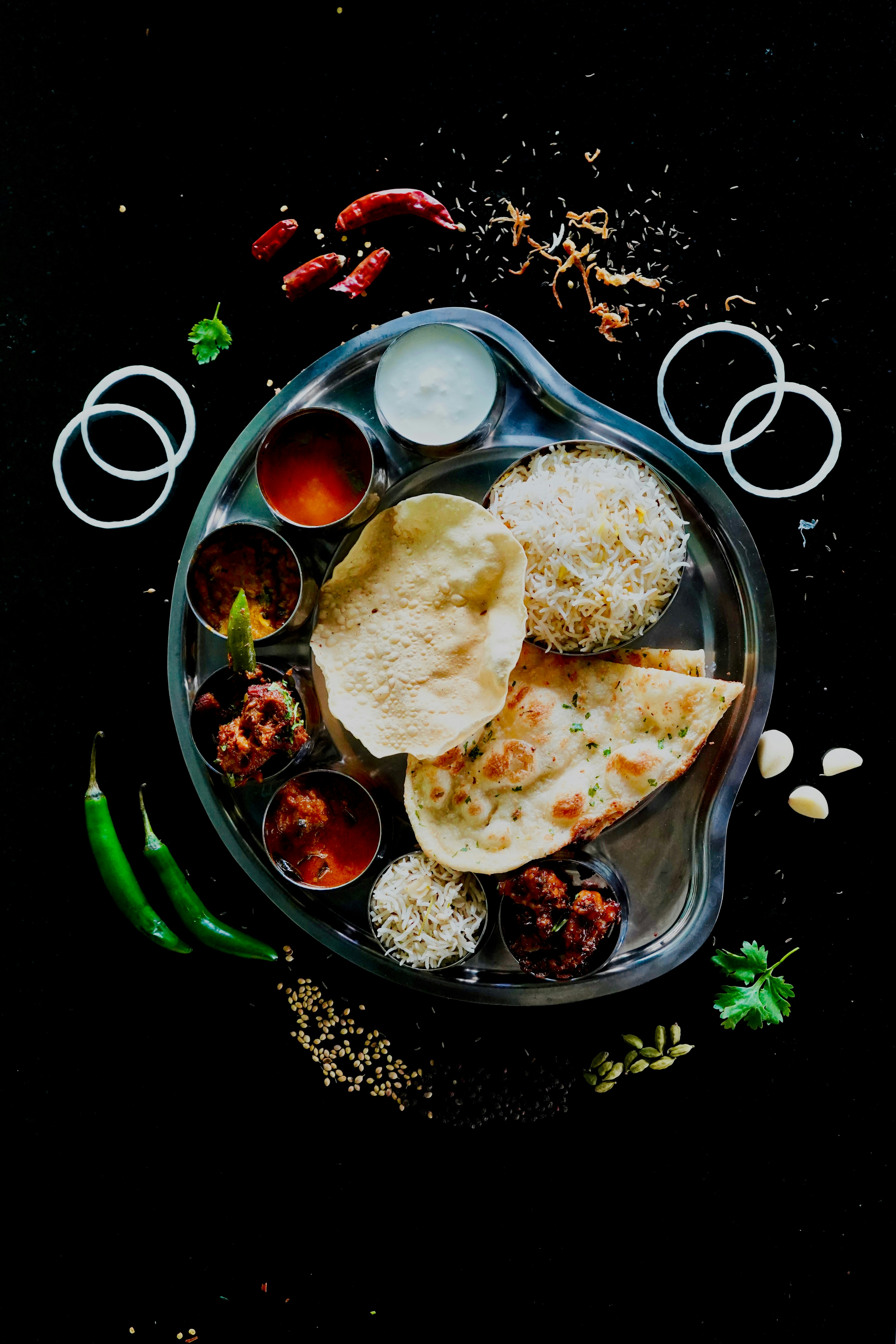 A person ordering food at an Indian restaurant